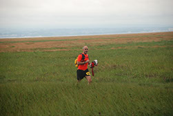 Man Running Across Fields
